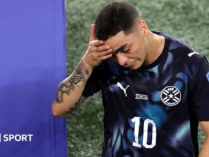Almiron first player sent off for covering mouth