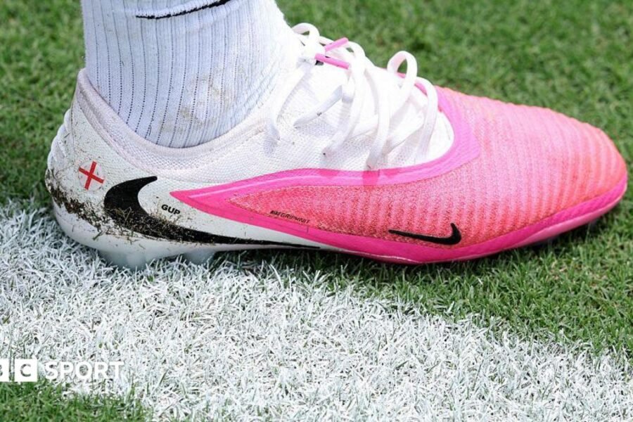 Why are footballers wearing pink boots at the World Cup?