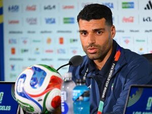 Iran team downplays protests: We aren’t political
