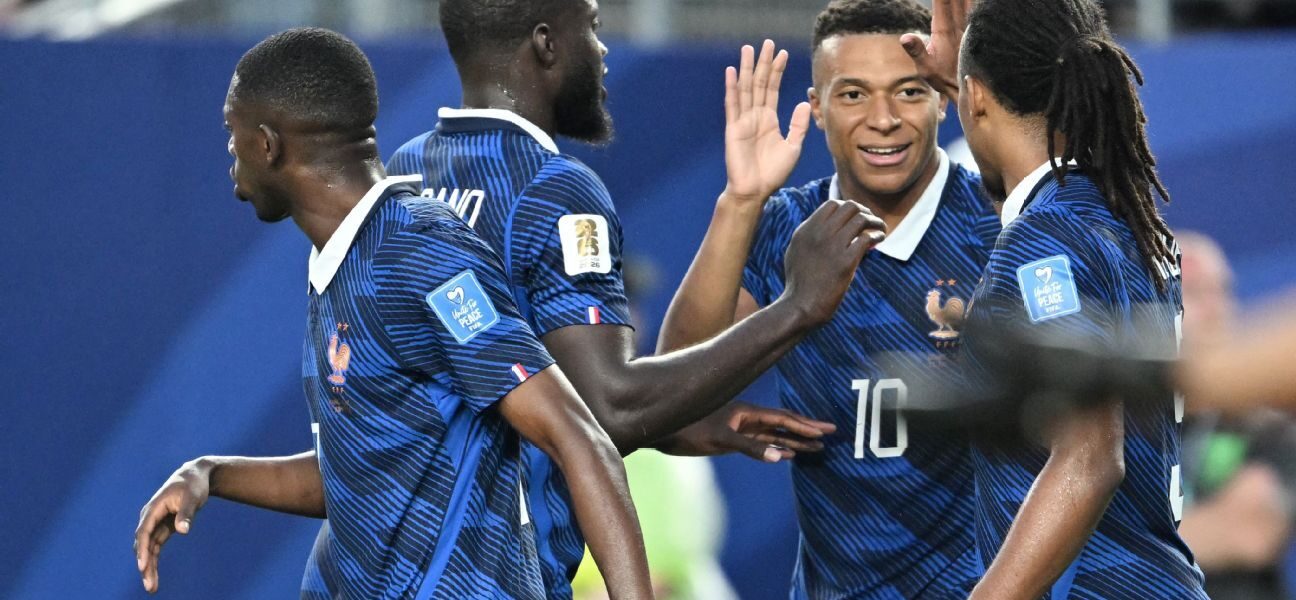 Mbappé makes it rain as storms delay France win