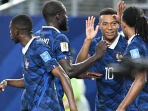 Mbappé makes it rain as storms delay France win